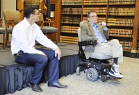 David Phipps, left, organizer of a medical marijuana town hall Saturday in Indianapolis, listens to former state Rep. Thomas Knollman of Liberty, who has multiple sclerosis, speak in support of legalizing cannabis for patients. CNHI New Indiana photo by Scott L. Miley