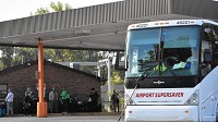 Patrons wait to board an airport shuttle bus at the Coach USA bus station at 8144 Indianapolis Blvd., in Highland on Sept. 12, 2017. Service from Valparaiso is scheduled to start Nov. 1. (Joe Puchek / Post-Tribune)