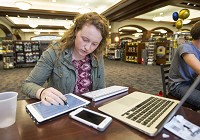 "The people who move off campus junior year have really good reasons," University of Notre Dame senior Claire Gaffney said Wednesday, commenting on a new policy that will require future undergraduates to live on campus for at least six semesters. She's shown here doing homework in the Hammes Notre Dame Bookstore. Tribune Photo/ROBERT FRANKLIN