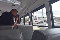 Seymour Police Assistant Chief Craig Hayes spots drivers not wearing seat belts, or driving distracted by using their phones to text or email on Thursday during a demonstration for Seymour Police Department's Operation Pull Over. Staff photo by Aaron Piper