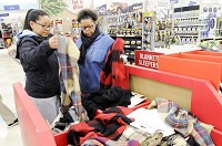 From left, Morgan and Natasha Edwards shop at Meijer in Anderson the morning after Thanksgiving in this file photo from 2016. Staff photo by&nbsp; Don Knight
