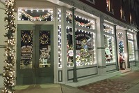 Street level decorations at Opera House Floral and Gifts are lit up for Christmas in downtown Winamac. Staff photo by Fran Ruchalski