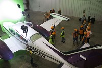 Cast and crew members work on a scene for Will the Real Martian Please Stand Up? at the Monroe County Airport. Courtesy photo by Marlie Burns