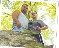 Dominique Tafoya and her father, Steve Tafoya, pose for a photo on a hike during a family vacation in Arkansas. Courtesy photo