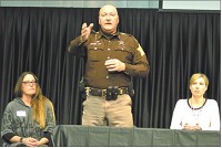 Boone County Sheriff Mike Nielsen answers a question from an audience member at the AgrIInstitute opioid forum held at the Boone County Fairgrounds Friday. Nielsen is flanked by Kimberly Buck of United Way, left, and Stephanie Woodcox of Purdue Extension. Staff photo by Leeann Doerflein