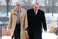 Former Lake County Sheriff John Buncich, right, and attorney Bryan Truitt approach the U.S. Courthouse and Federal Building on Tuesday before his sentencing. Staff photo by Kle Wilk