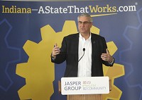 
ORLEANS &mdash; Indiana Gov. Eric Holcomb addresses the crowd during the ceremony celebrating the fact that the Jasper Group, a manufacturer of seating and case good products, purchased the former Paoli Inc. manufacturing site south of Orleans. Staff photo by Garet Cobb

