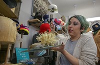Amanda Joyner works on a hat at her business, Chef Bizzaro Millinery. Staff photo by John J. Watkins