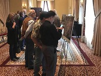 Residents attending a meeting in the Crystal Ballroom look over drawings illustrating the River District Revitalization. Staff&nbsp; photo by Blair Yankey 
