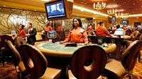 Latoy Cook waits for customers at her blackjack table during the opening of Ameristar Casino's new 15,000 square foot landslide gaming room on May 24, 2018. (Suzanne Tennant / Post-Tribune)