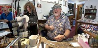 Al Drake is shown at work in his Nashville business, Touch of Silver, Gold &amp; Old. He started off selling handmade sterling silver spoon rings on the streets of Nashville in 1972, and he has been able to survive through economic ups and downs. (Herald-Times / DAVID SNODGRESS)