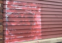 Red paint now obscures Aaron Molden&rsquo;s riot police-inspired piece. (Photo: Wei-Huan Chen/Journal &amp; Courier )