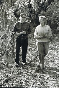 Hollace and Ila Sherwood, founders of the Bryantsville Hunger Relief Project, walk their farm where the high protein corn is grown. In 30 years since the project&rsquo;s founding, 170,000 bags of corn have been sent to feed the hungry around the world. Courtesy photo