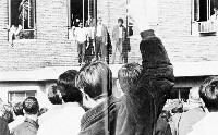 Students stand outside the Indiana State University president&rsquo;s office and in the room of the entryway to the old administration building in this photo from 1969. Indiana State University archives