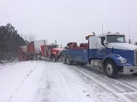 A truck is towed near mile marker 27 on Interstate 94 in Michigan on Sunday. WSBT Photo