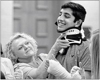 Regina Smith, a registered orthopedic technician at Deaconess, adjusts a cervical collar worn by Arjun Dhawan of Newburgh during the Deaconess Health Science Institute on Tuesday. The two-week-long program gives high school students a chance to learn about various medical procedures. Staff photo by Jason Clark