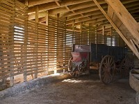 Inside view of the historic Thomas C. Singleton barn built in 1908. The cart belonged to the owner, Cindy Barber's great-grandfather, Thomas C. Singleton.&nbsp;(Photo: MaCabe Brown / Courier &amp; Press)