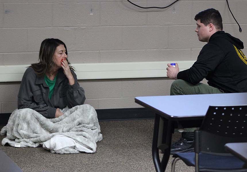 Jay County Sheriff’s Office hosted crisis intervention training this week for law enforcement. Jay and Blackford counties are starting a crisis intervention team dedicated to better serve those with mental illness in crisis. Pictured above, Brooke Aker acts out a scenario while sheriff’s deputy Tre Nusbaumer responds. (The Commercial Review/Bailey Cline)