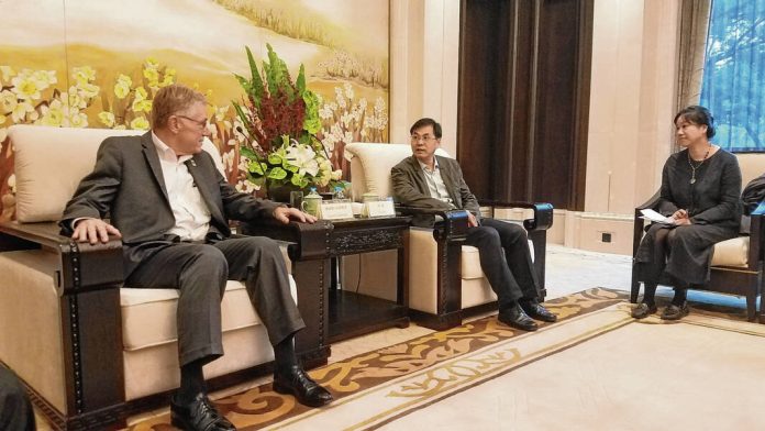 Columbus Mayor Jim  Lienhoop (left)meets in Hangzhou City with Peng Bo, middle, vice director of the Xiangyang, China Provincial Foreign Affairs Office, during a trade mission to China. Xiangyang, China is Indiana’s sister city. The Republic file photo
