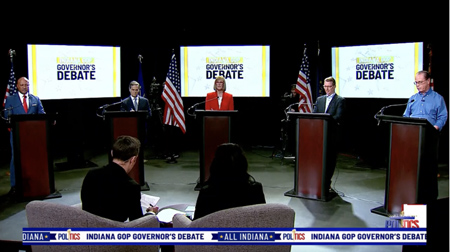  Five gubernatorial candidates appear on a debate stage in downtown Indianapolis on March 27, 2024.  From left, pictured are Curtis Hill, Brad Chambers, Lt. Gov. Suzanne Crouch, Eric Doden and U.S. Sen. Mike Braun. (Screenshot from WISH-TV livestream)